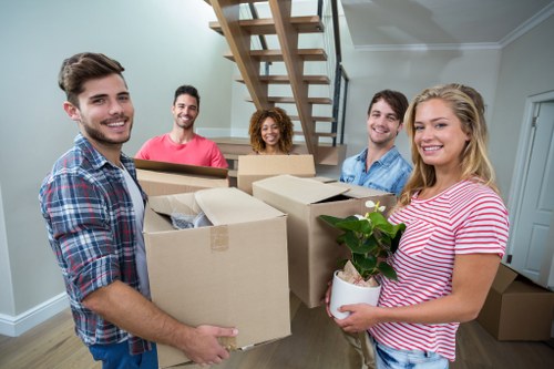 Removal team loading household items for a Kingston move