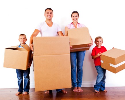 Student moving boxes with a van service in Kingston
