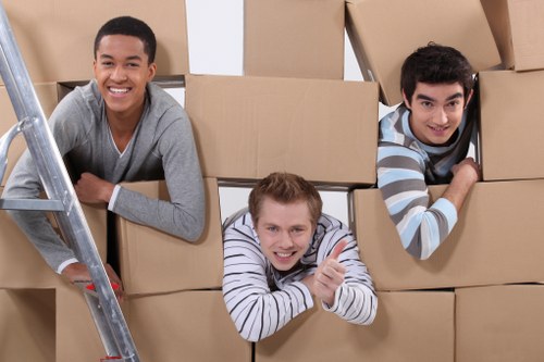 Professional movers preparing items for transport in Kingston
