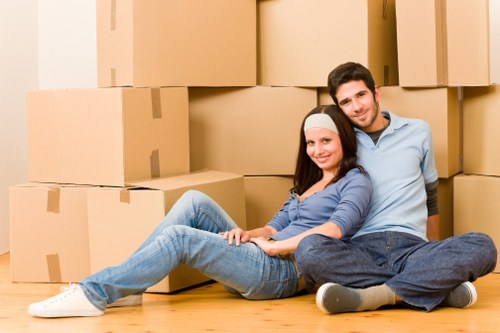 Moving van and packed boxes outside a Kingston apartment building