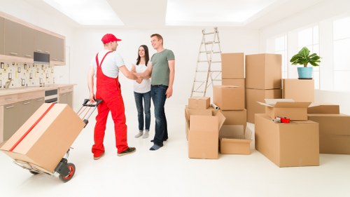 Furniture being carefully moved from a flat in Kingston