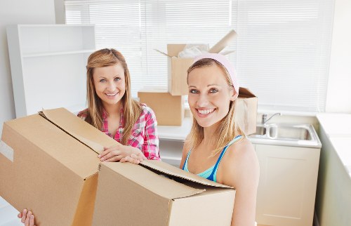 Moving day scene for house removals in Kingston with organised boxes