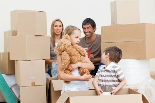 Packing boxes and furniture for a Kingston moving truck